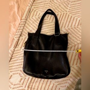 Fossil. Leather black shoulder bag with gold zipper extension detail. Black.